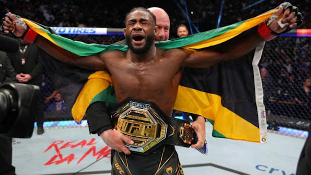 Aljamain Sterling celebrates after defeating Petr Yan in their bantamweight unification title fight at UFC 273.